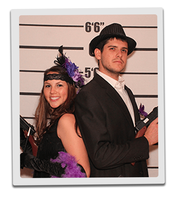 Grand Rapids Murder Mystery party guests pose for mugshots