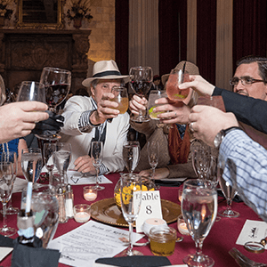 Grand Rapids Murder Mystery guests raise glasses