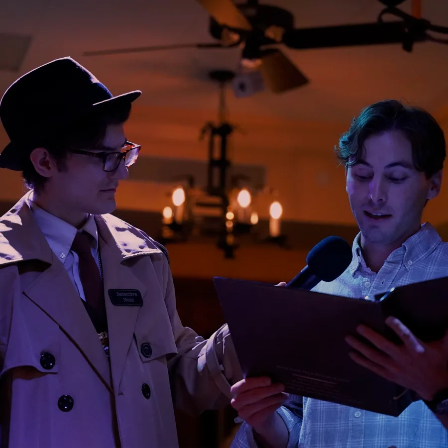 Professional actors performing at a Grand Rapids murder mystery